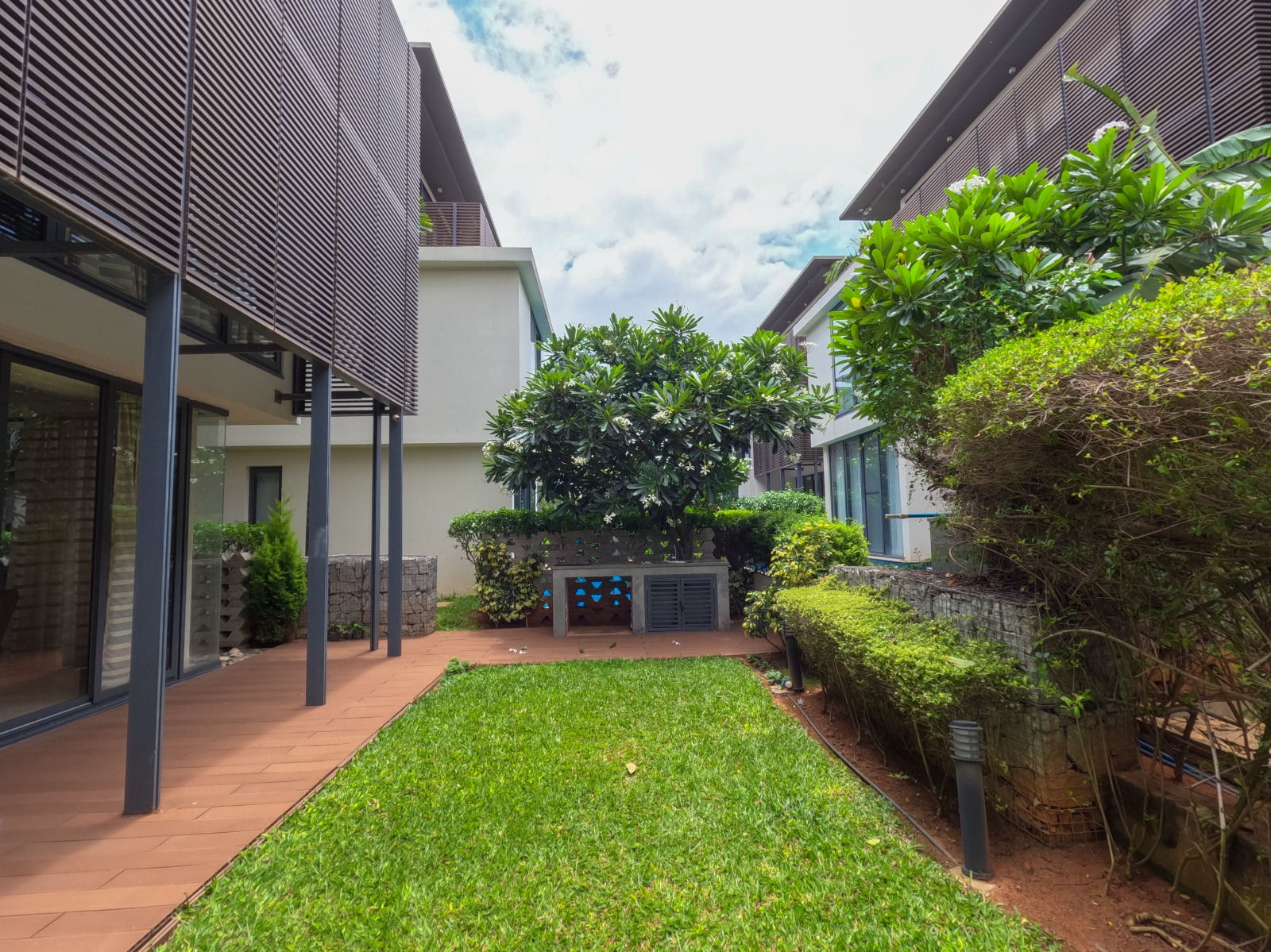 Landscaped private gardens between contemporary villas at Embassy Boulevard, Yelahanka